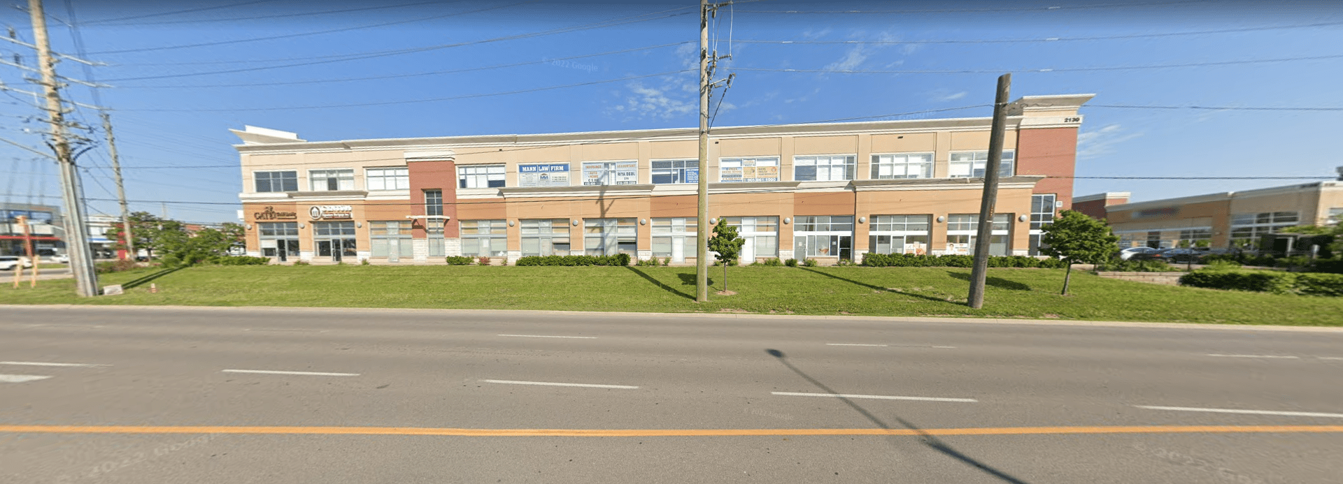 Front entrance of Peel Truck Driving School office in Mississauga with parking area outside.
